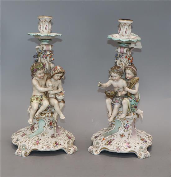 A pair of Rudolstadt Volkstedt porcelain candlesticks, with putti stems height 31cm